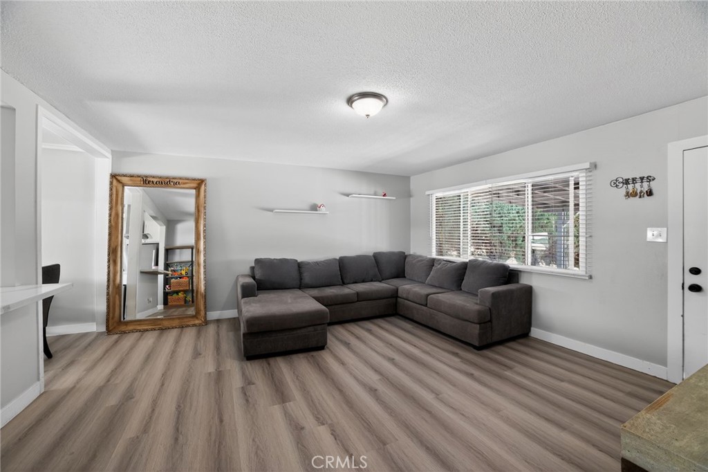 116 Doyle Avenue Redlands, CA 92374 - Photo 2 of 11 a living room with furniture and a large window