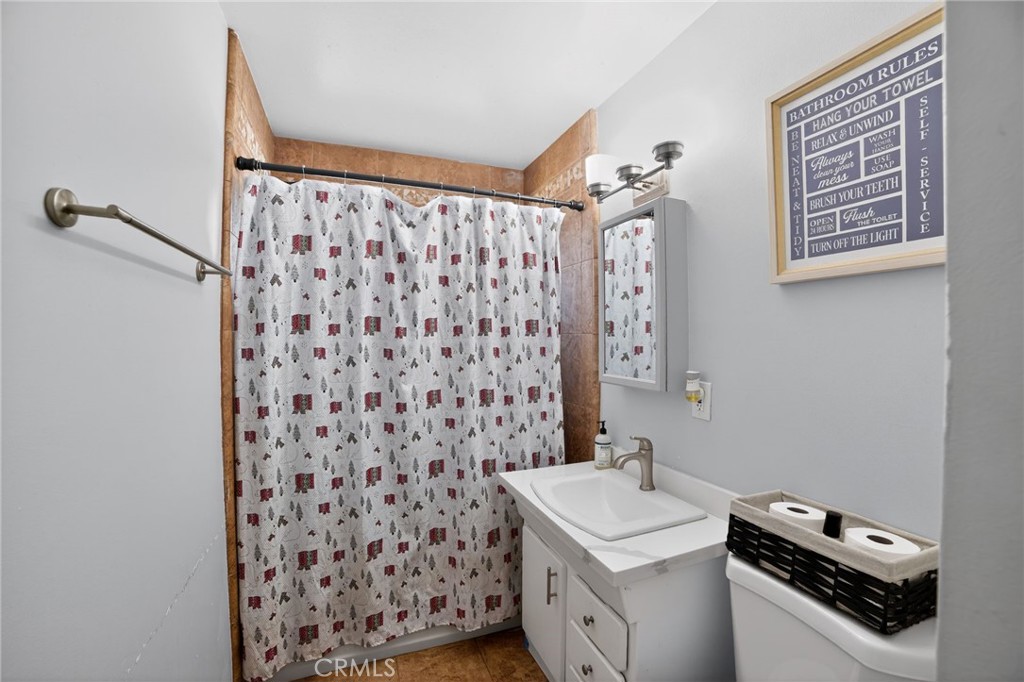 116 Doyle Avenue Redlands, CA 92374 - Photo 9 of 11 a bathroom with a sink toilet and shower