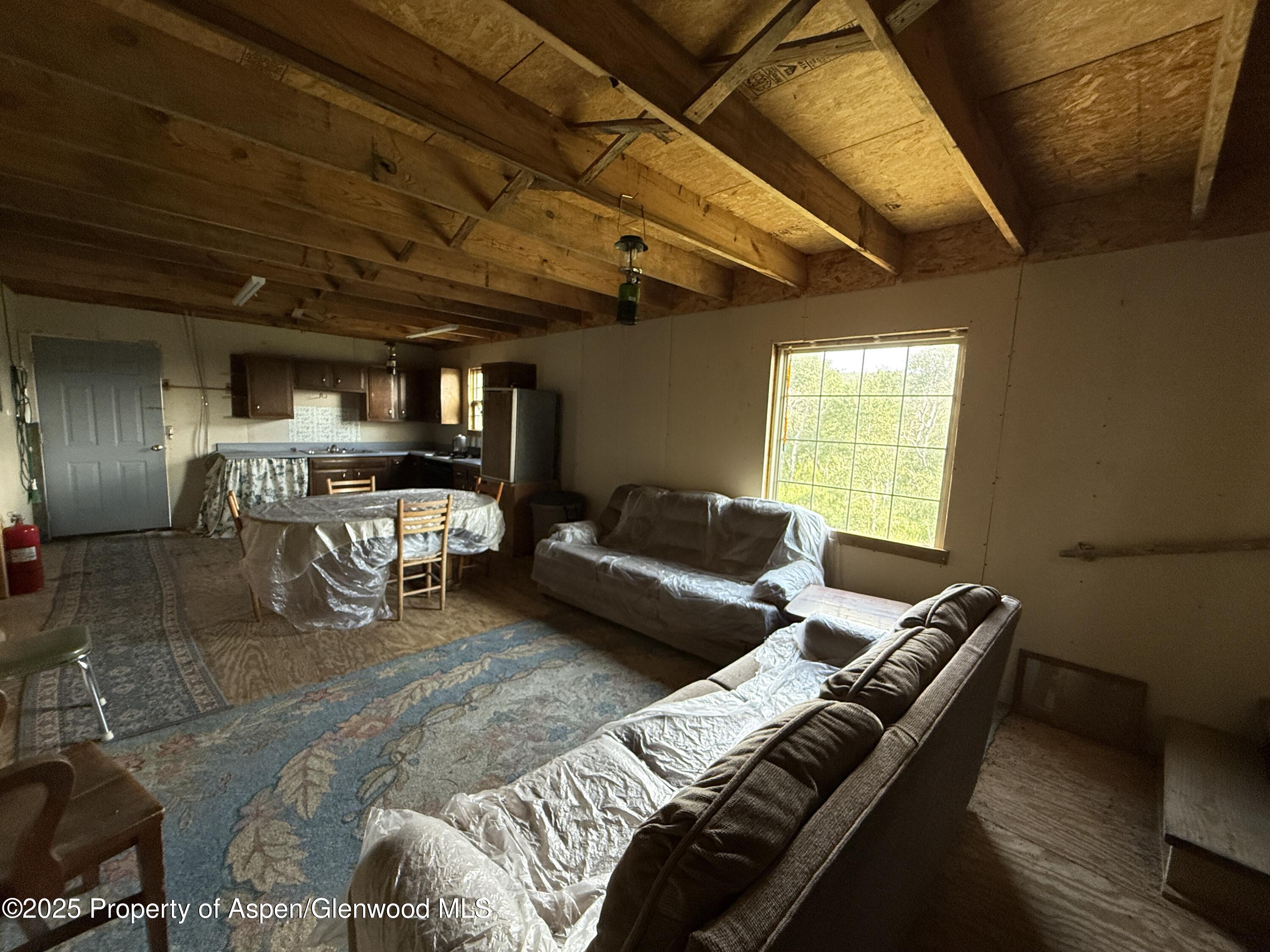 276 Sycamore Road, Unit LOT 288 Craig, CO 81625 - Photo 17 of 24 a living room with furniture and a table