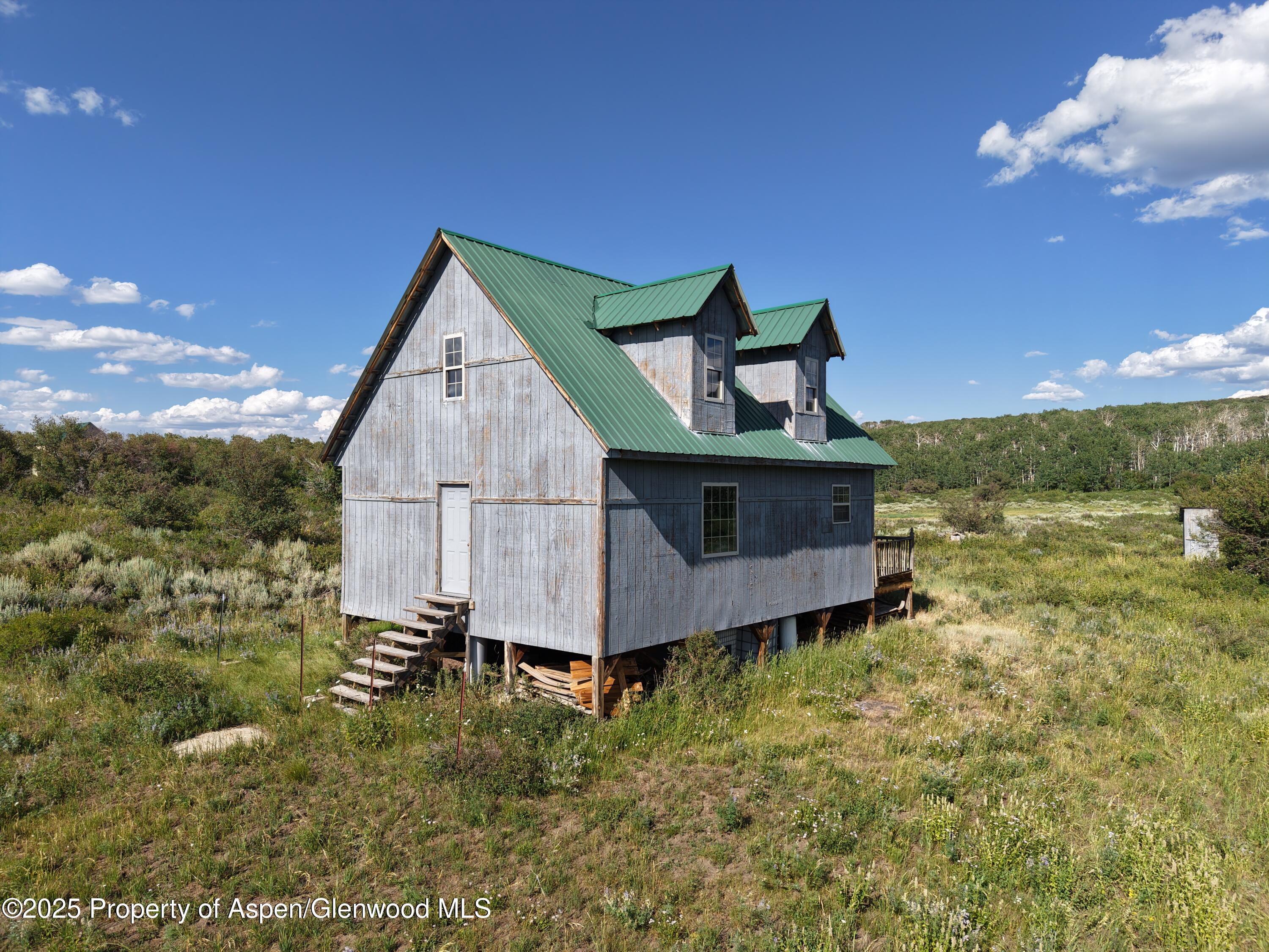 276 Sycamore Road, Unit LOT 288 Craig, CO 81625 - Photo 7 of 24 a front view of a house with garden