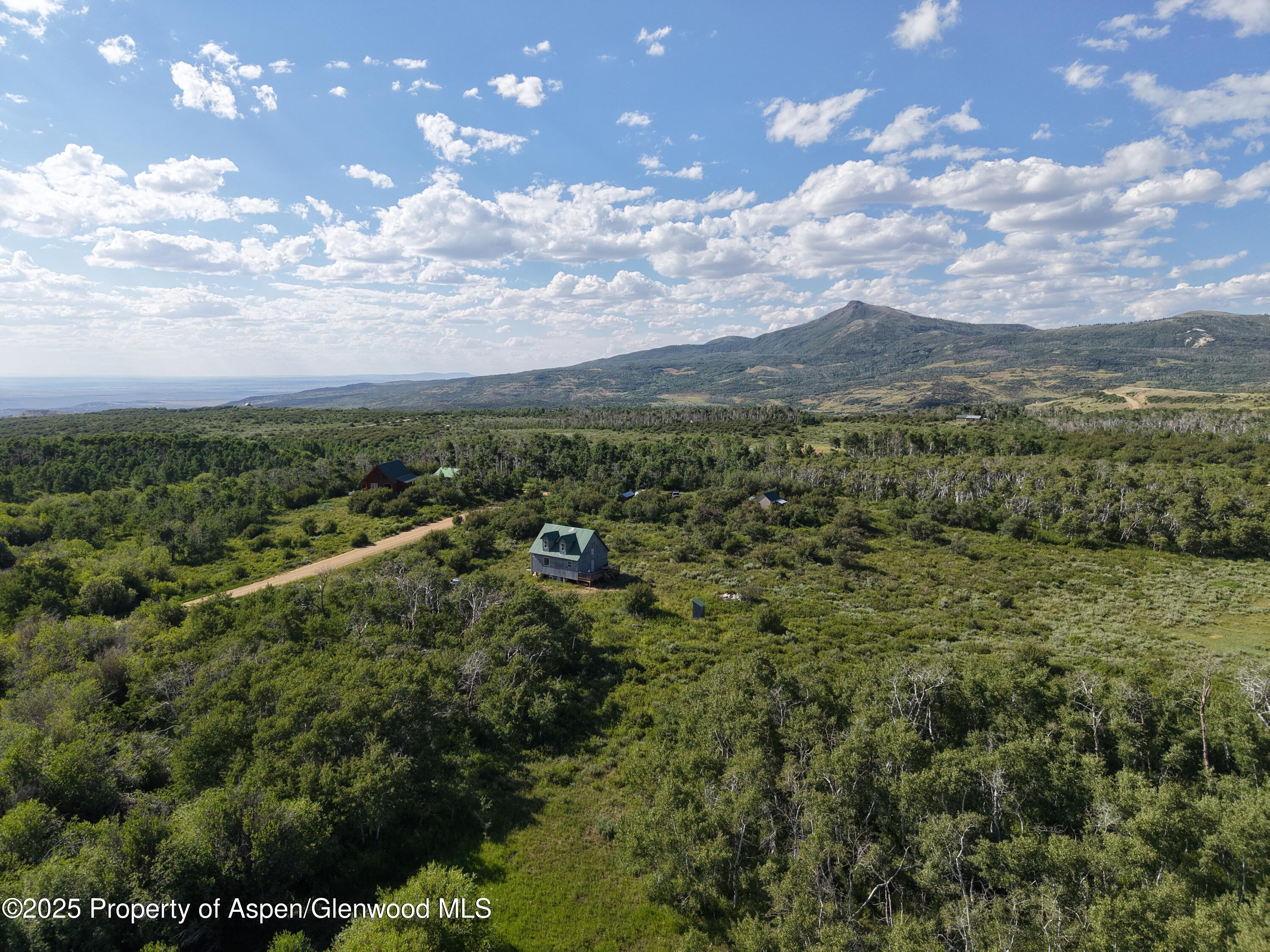 276 Sycamore Road, Unit LOT 288 Craig, CO 81625 - Photo 10 of 24 a view of a city with lush green forest