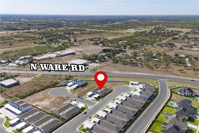an aerial view of a house with a swimming pool