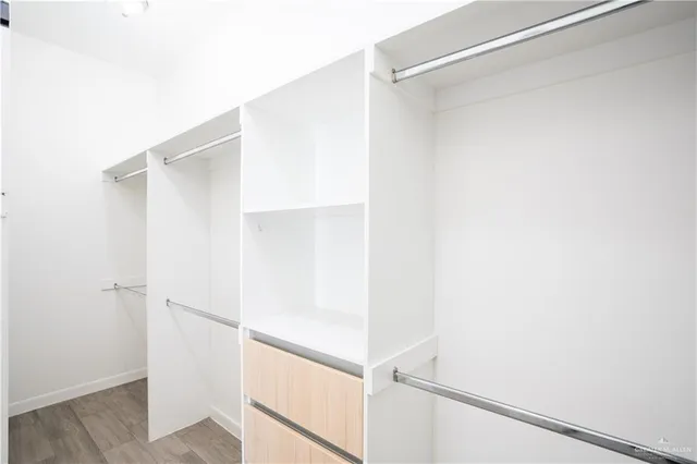 a view of an empty walk in closet