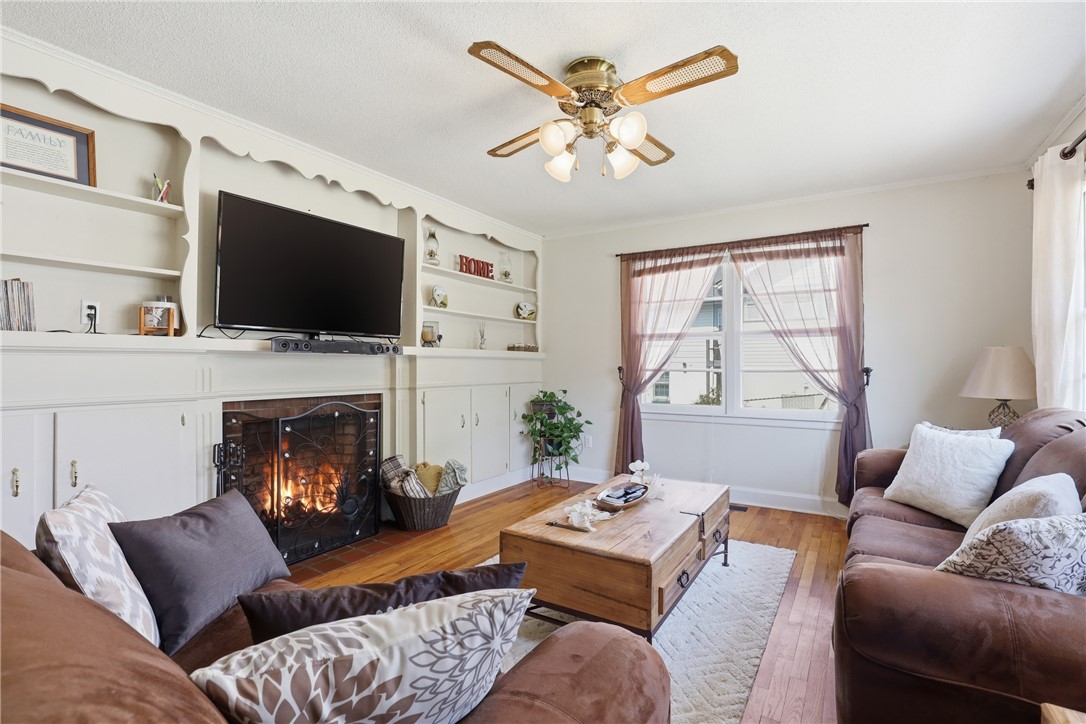 602 South Tugaloo Street Walhalla, SC 29691 - Photo 12 of 38 This inviting living area features a charming fireplace, perfect for cozy gatherings and relaxation.
