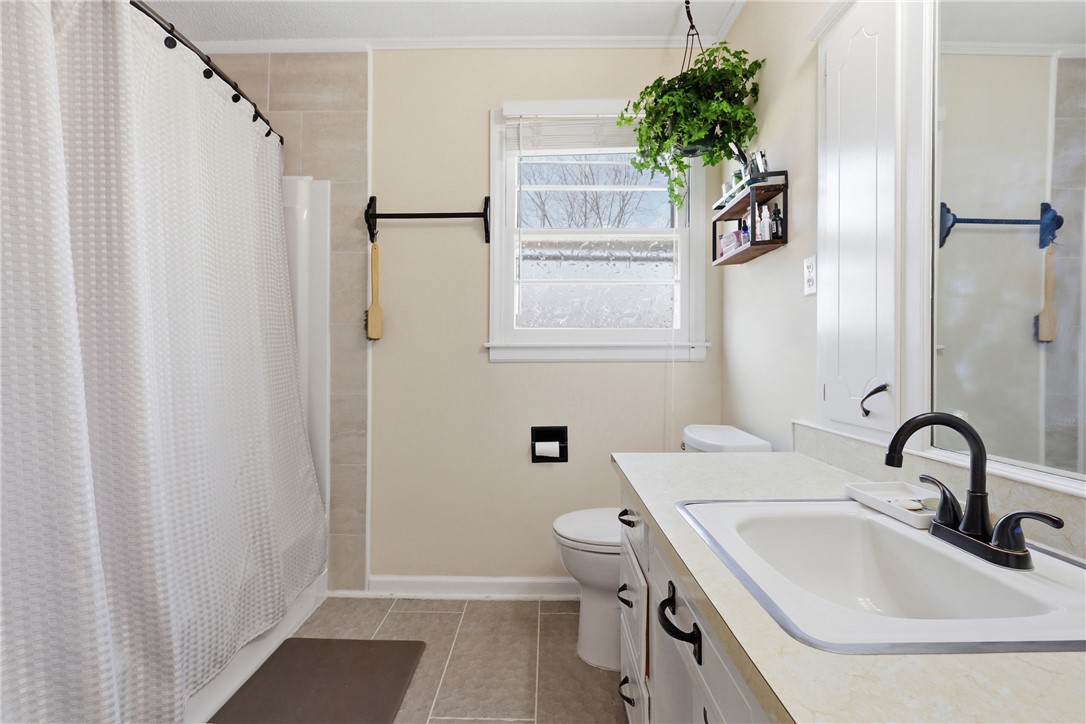 602 South Tugaloo Street Walhalla, SC 29691 - Photo 16 of 38 This bathroom features practical design with a shower and functional vanity, ready for daily routines.