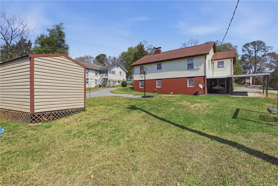 602 South Tugaloo Street Walhalla, SC 29691 - Photo 29 of 38 This spacious yard offers ample outdoor potential with a functional shed.