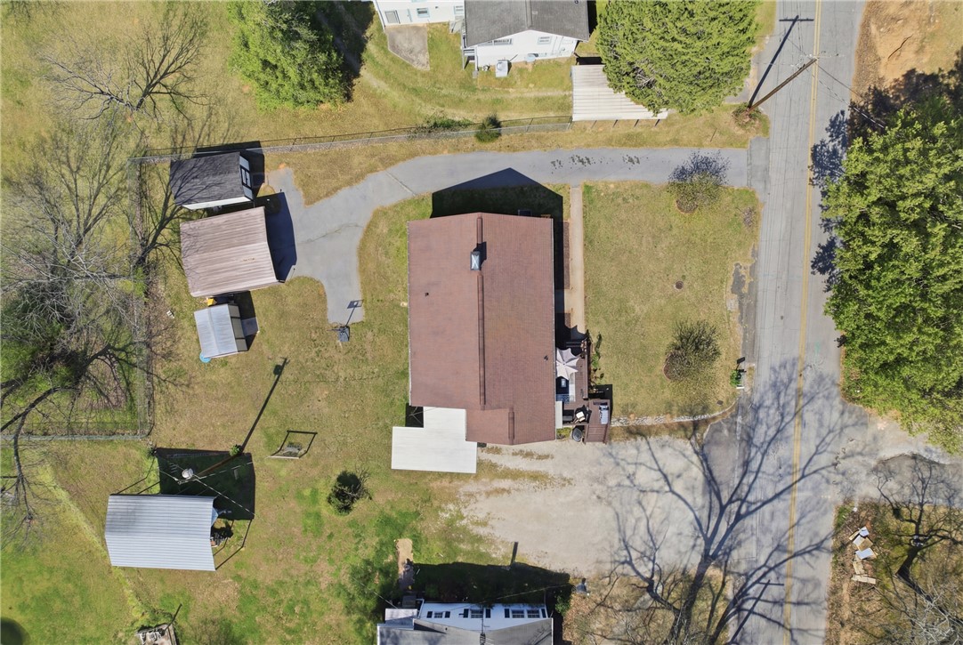 602 South Tugaloo Street Walhalla, SC 29691 - Photo 33 of 38 An aerial view showcases a residential property with ample yard space and mature trees.