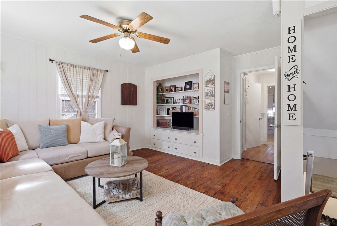 602 South Tugaloo Street Walhalla, SC 29691 - Photo 6 of 38 Warm and inviting living space with rich hardwood floors and built-in storage solutions.