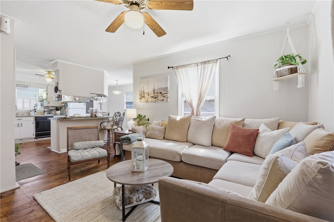 602 South Tugaloo Street Walhalla, SC 29691 - Photo 7 of 38 This inviting space seamlessly connects living and dining areas, creating an open and airy atmosphere.