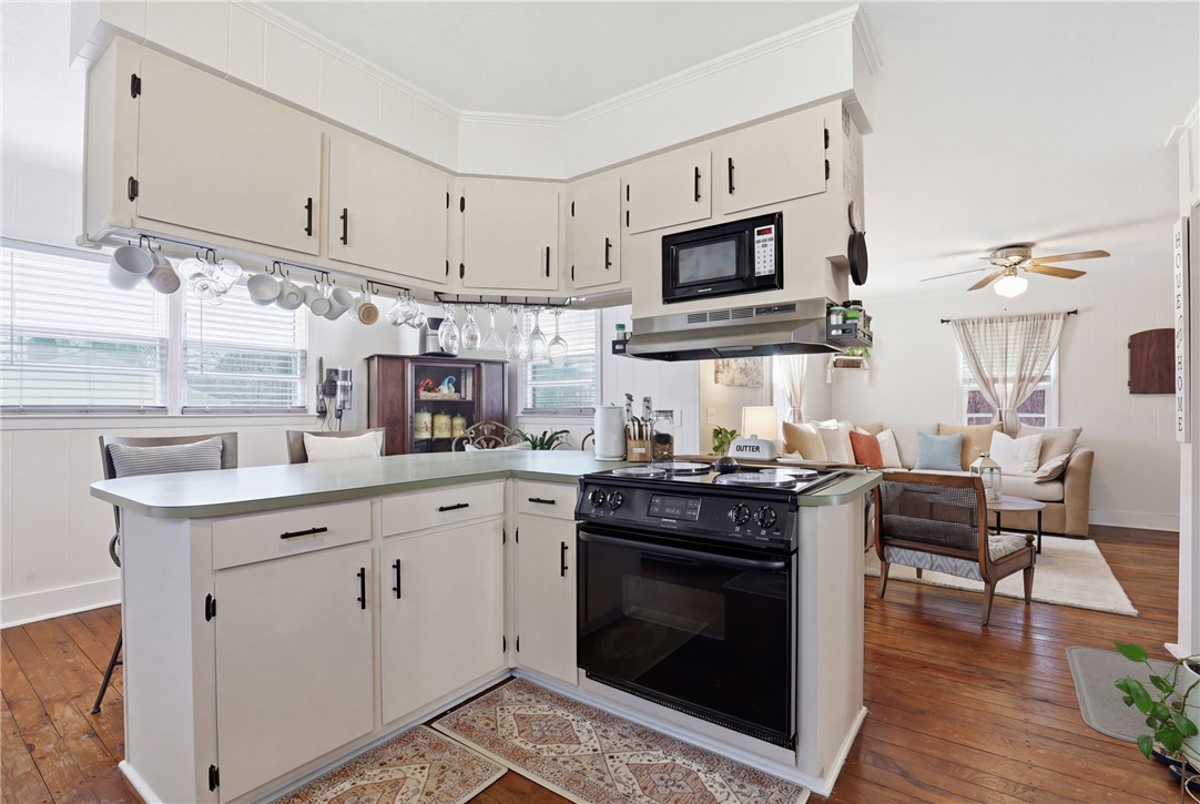 602 South Tugaloo Street Walhalla, SC 29691 - Photo 8 of 38 This bright kitchen offers a practical layout for seamless meal preparation and entertaining.