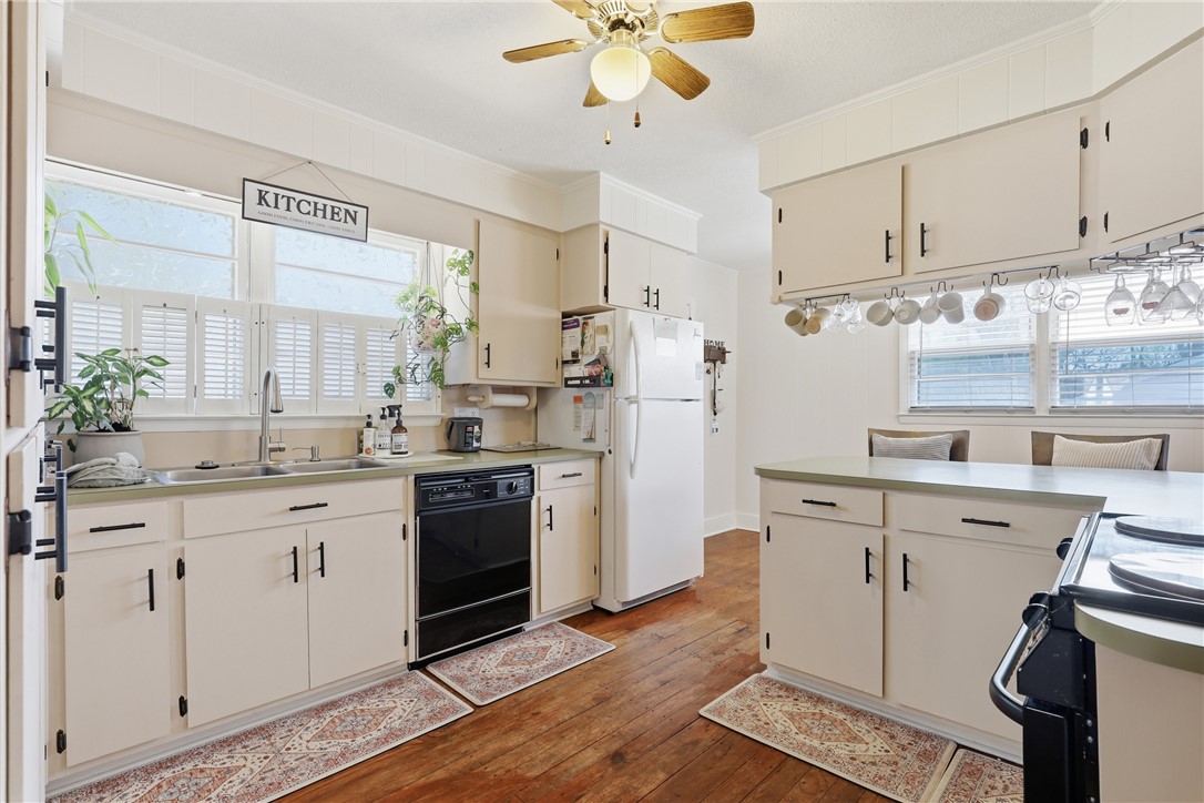 602 South Tugaloo Street Walhalla, SC 29691 - Photo 9 of 38 This cozy kitchen features a classic aesthetic with ample natural light.
