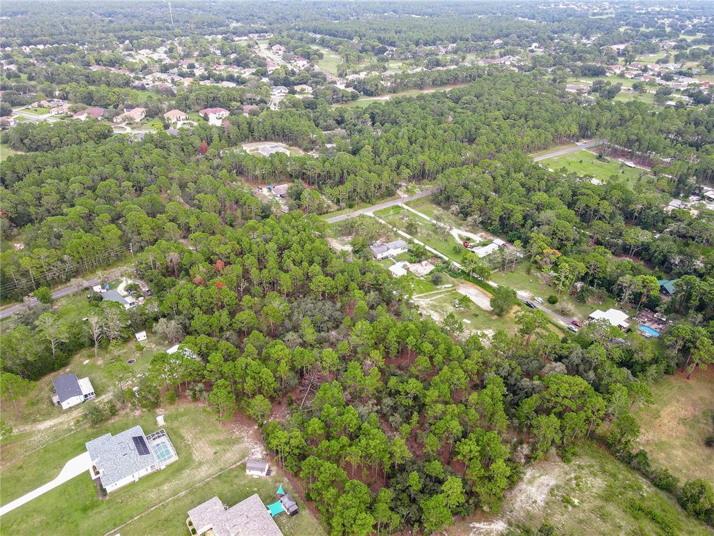 5411 Nodoc Road Spring Hill, FL 34609 - Photo 6 of 7 an aerial view of a residential houses with yard