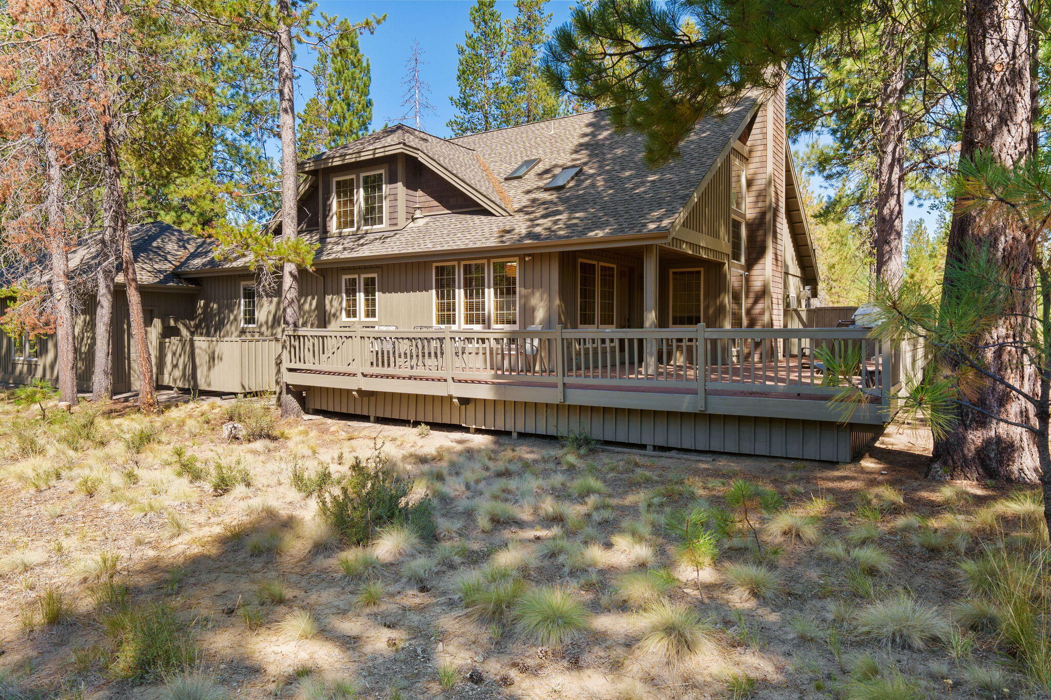 58026 Kinglet Road Sunriver, OR 97707 - Photo 29 of 39 a house that has a tree in front of it