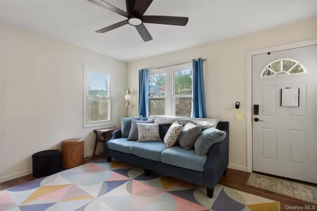 a living room with furniture and windows