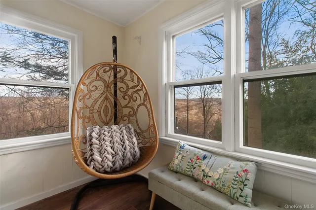 a view of a living room filled with furniture