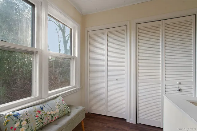 a view of an entryway with wooden floor