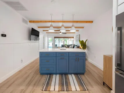 a bathroom with a sink a mirror and window