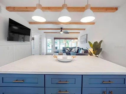 a view of kitchen with cabinets and appliances