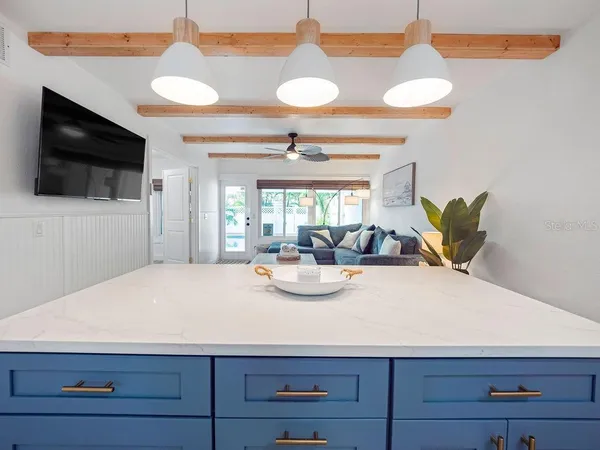 a view of kitchen with cabinets and appliances