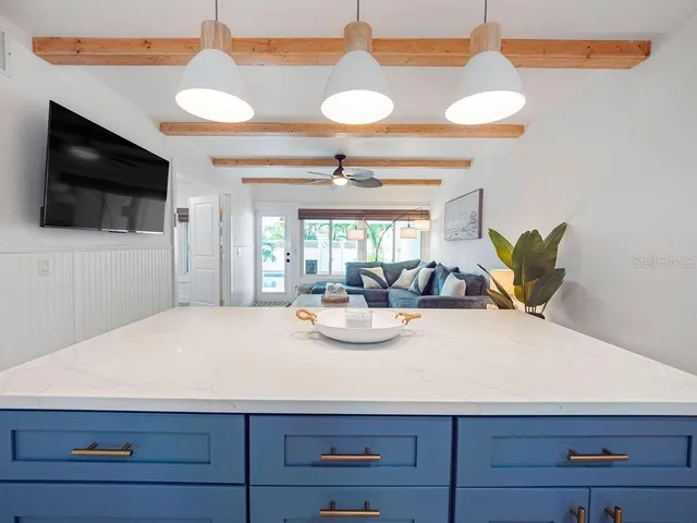 a view of kitchen with cabinets and appliances