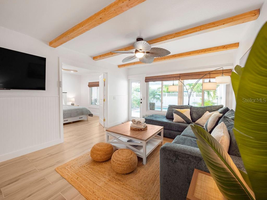 449 63rd Street Holmes Beach, FL 34217 - Photo 24 of 54 a living room with furniture and a flat screen tv