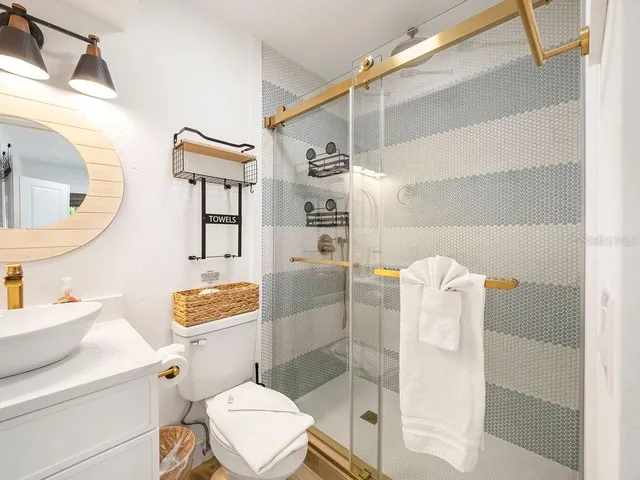 a bathroom with a tub and a shower
