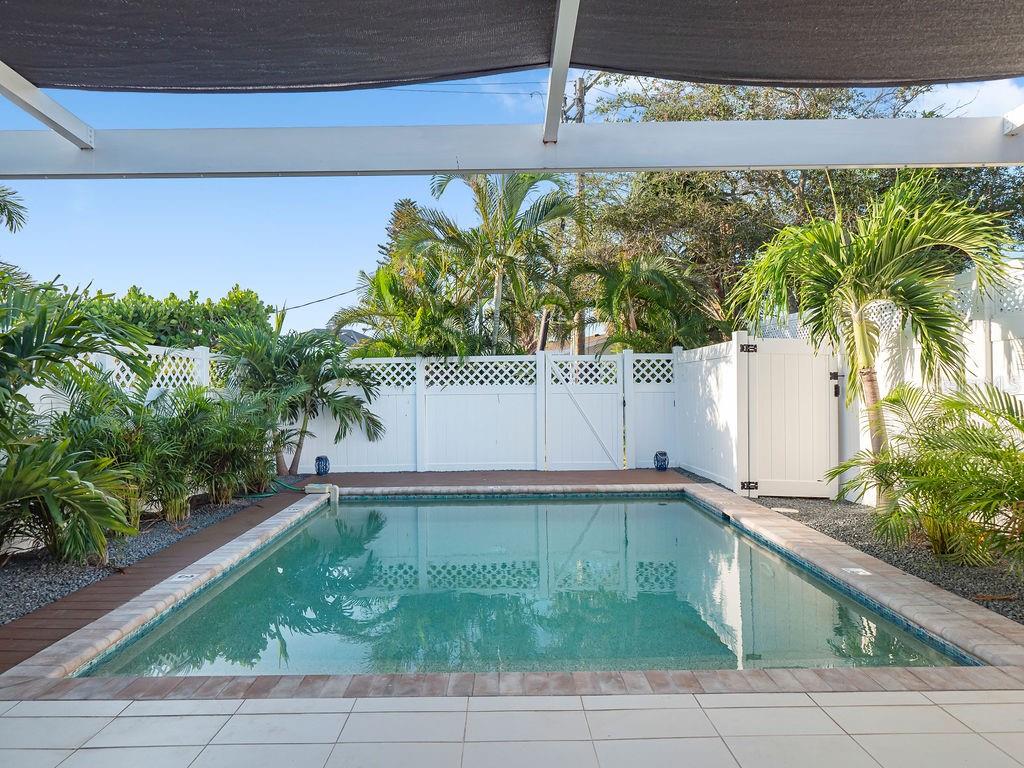 449 63rd Street Holmes Beach, FL 34217 - Photo 33 of 54 a view of a backyard with plants