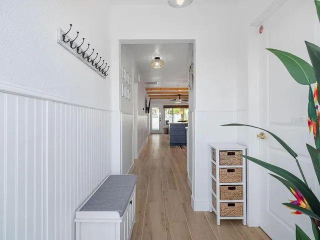 a bathroom with a sink a mirror and a shower