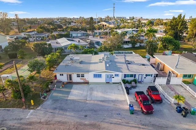 an aerial view of a house with a lake view