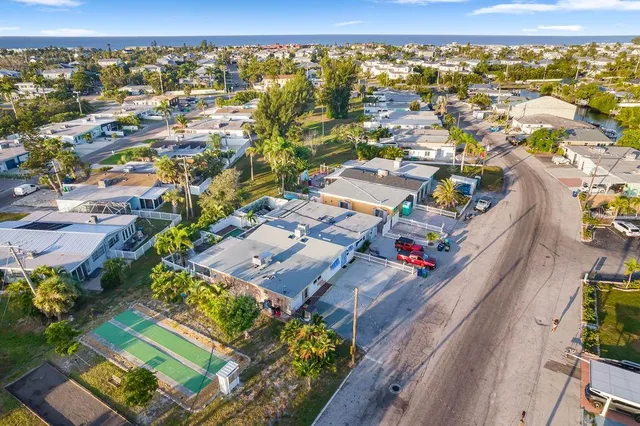 an aerial view of residential houses with outdoor space