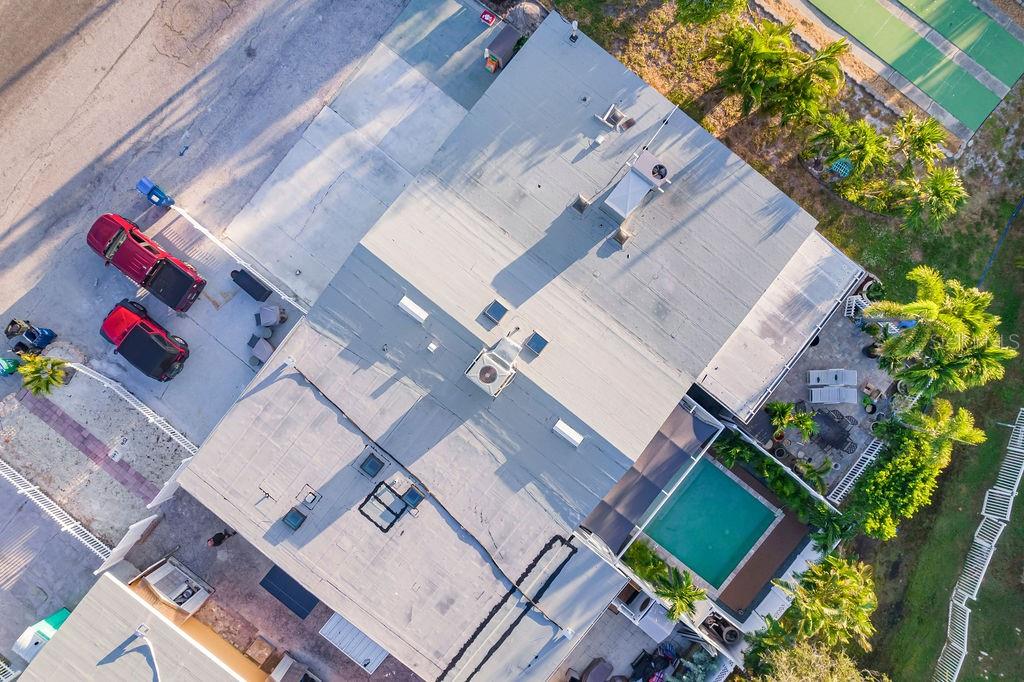 449 63rd Street Holmes Beach, FL 34217 - Photo 49 of 54 an aerial view of a house with a yard