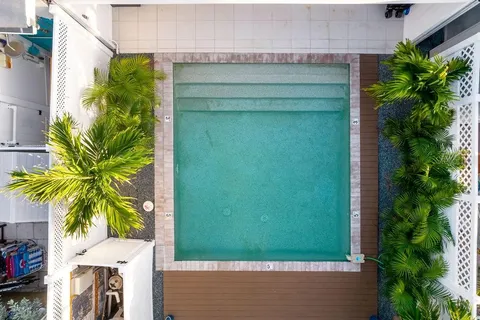 an aerial view of residential houses and outdoor space