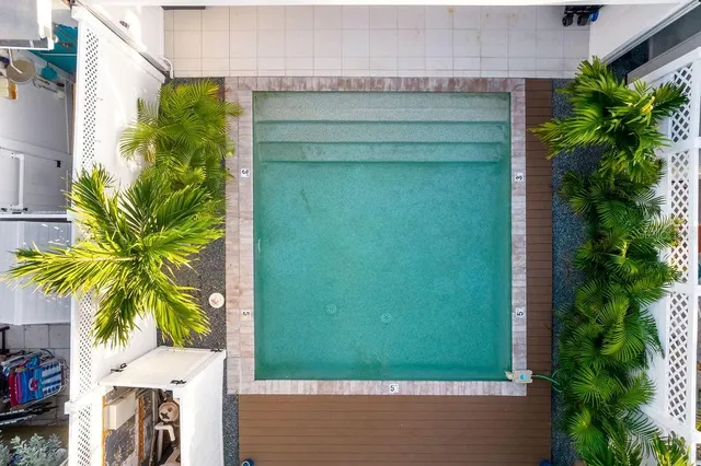 an aerial view of residential houses and outdoor space