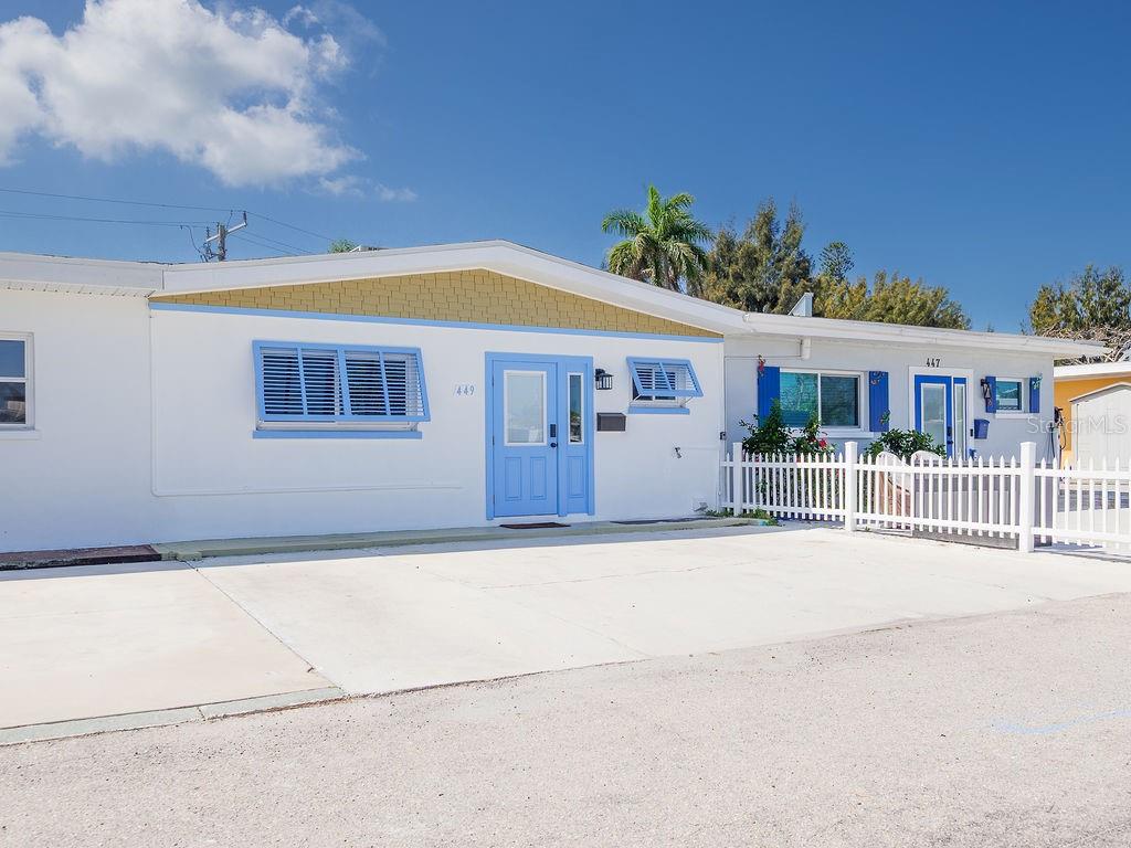 449 63rd Street Holmes Beach, FL 34217 - Photo 54 of 54 front view of a house with a small yard
