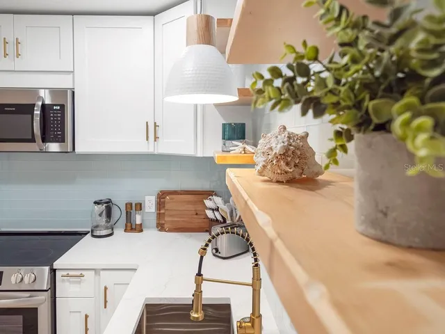 a table with a vase and flowers on it