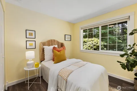 a bedroom with a bed and a table