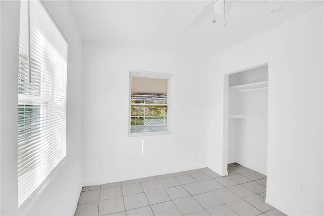 a view of an empty room with a window