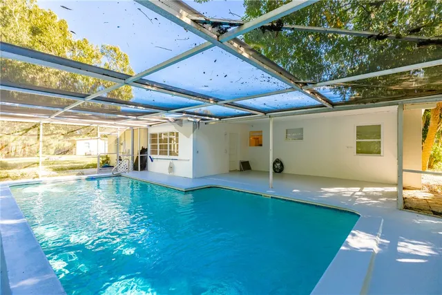 a view of swimming pool with a yard