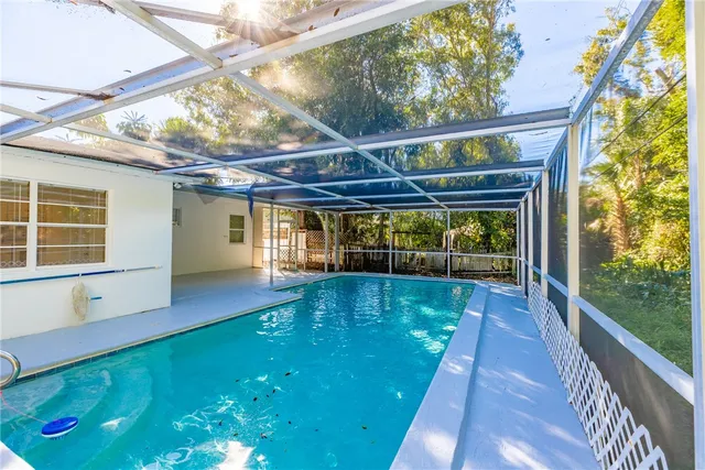 a view of swimming pool with a patio