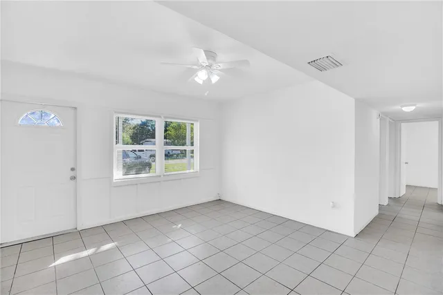 a view of an empty room with a window
