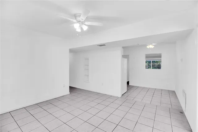 a view of an empty room and window