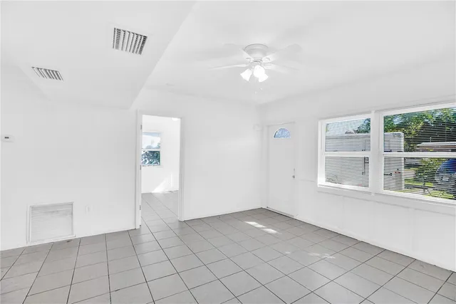 a view of an empty room with a window