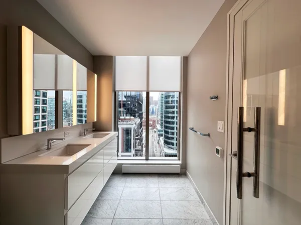 a spacious bathroom with a tub and a sink