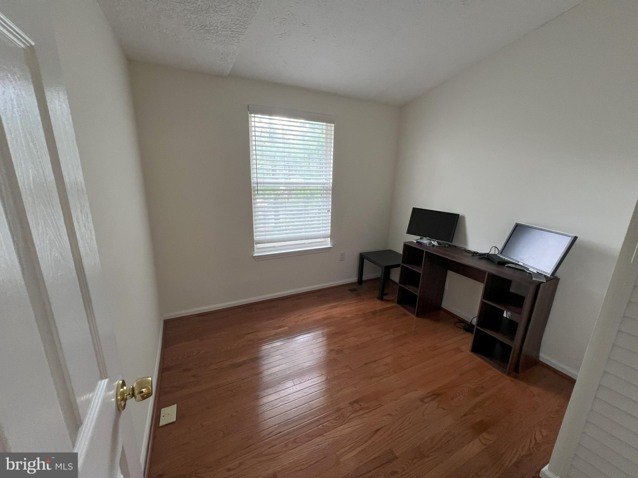 14027 Great Notch Terrace North Potomac, MD 20878 - Photo 11 of 27 a view of a workspace with furniture and a window
