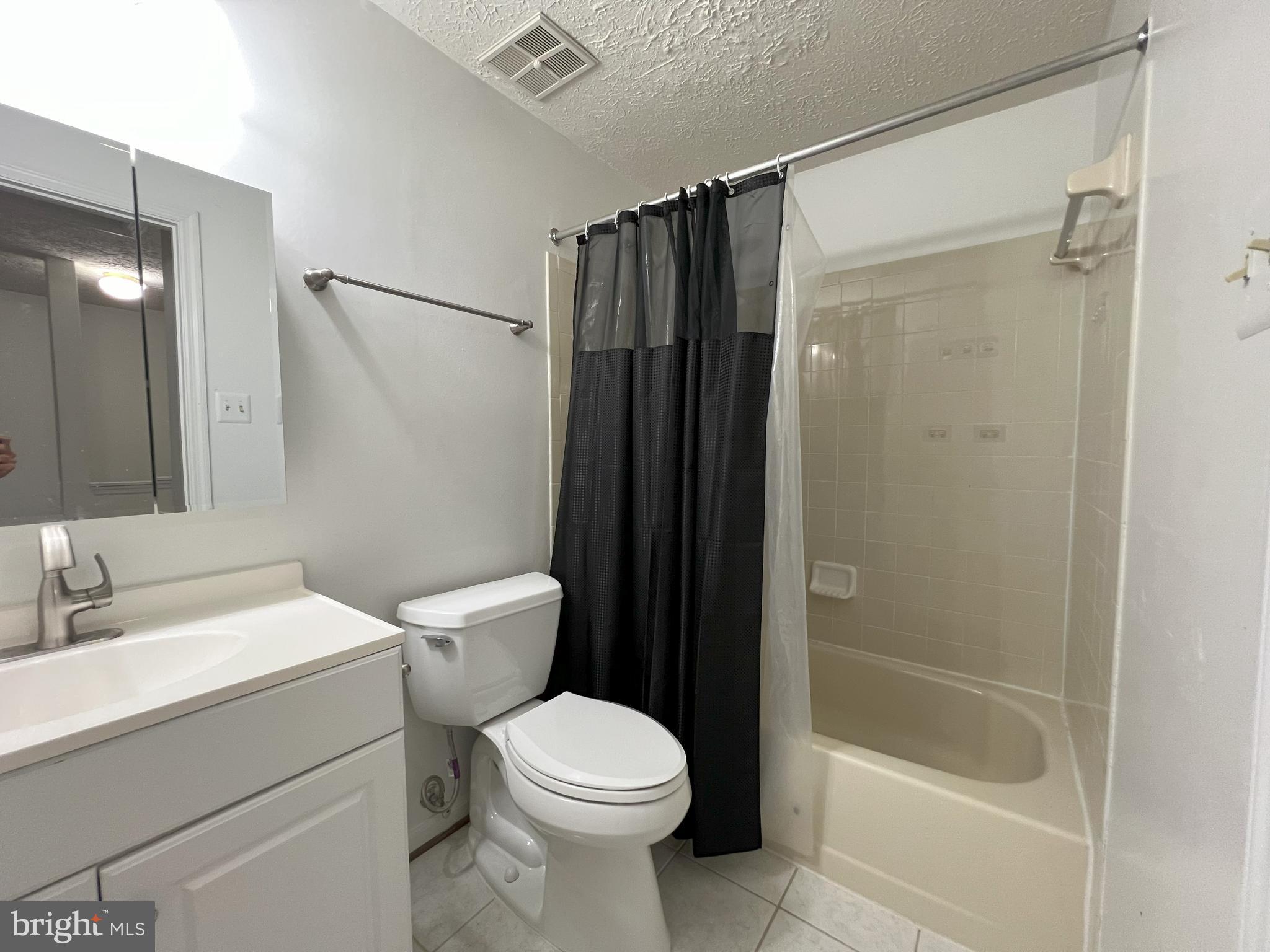 14027 Great Notch Terrace North Potomac, MD 20878 - Photo 15 of 27 a bathroom with a shower and a toilet