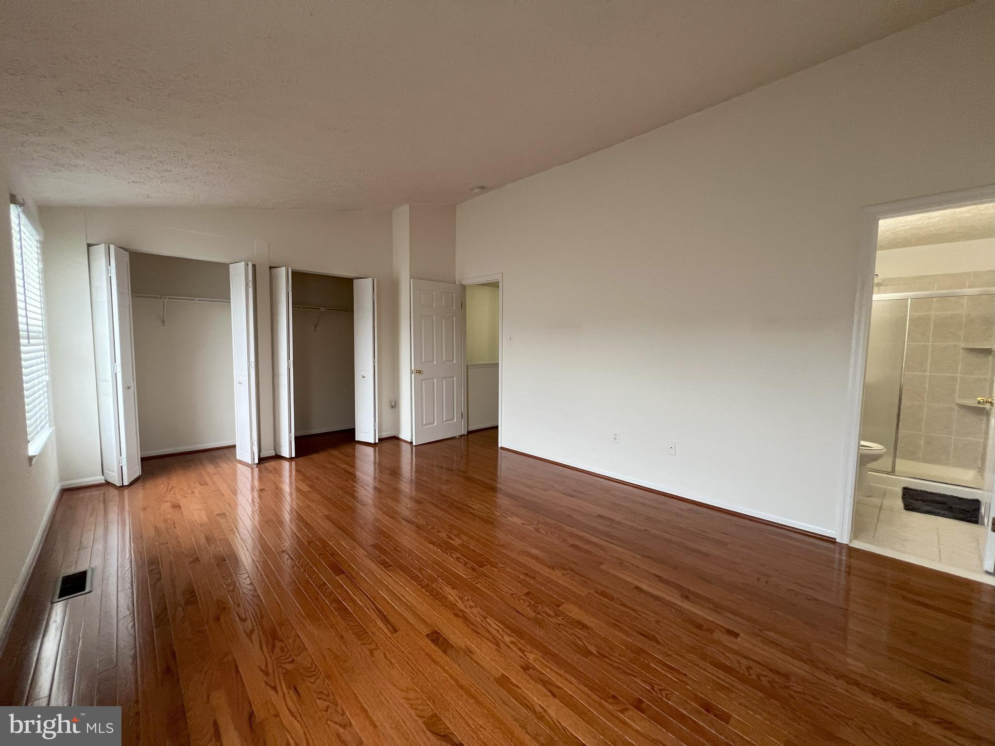 14027 Great Notch Terrace North Potomac, MD 20878 - Photo 17 of 27 a view of an empty room with wooden floor and a window