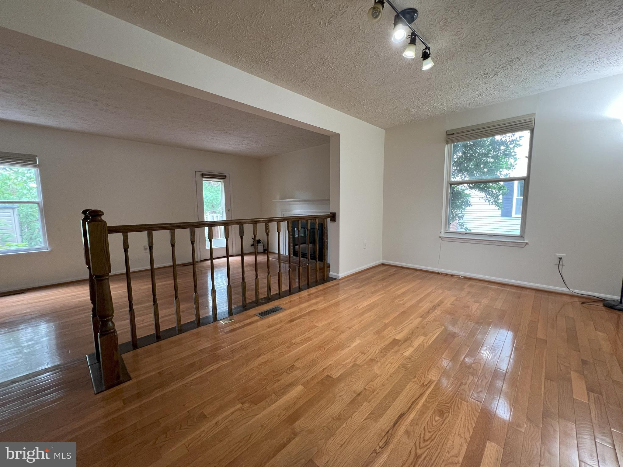 14027 Great Notch Terrace North Potomac, MD 20878 - Photo 6 of 27 a view of an empty room with wooden floor and a window