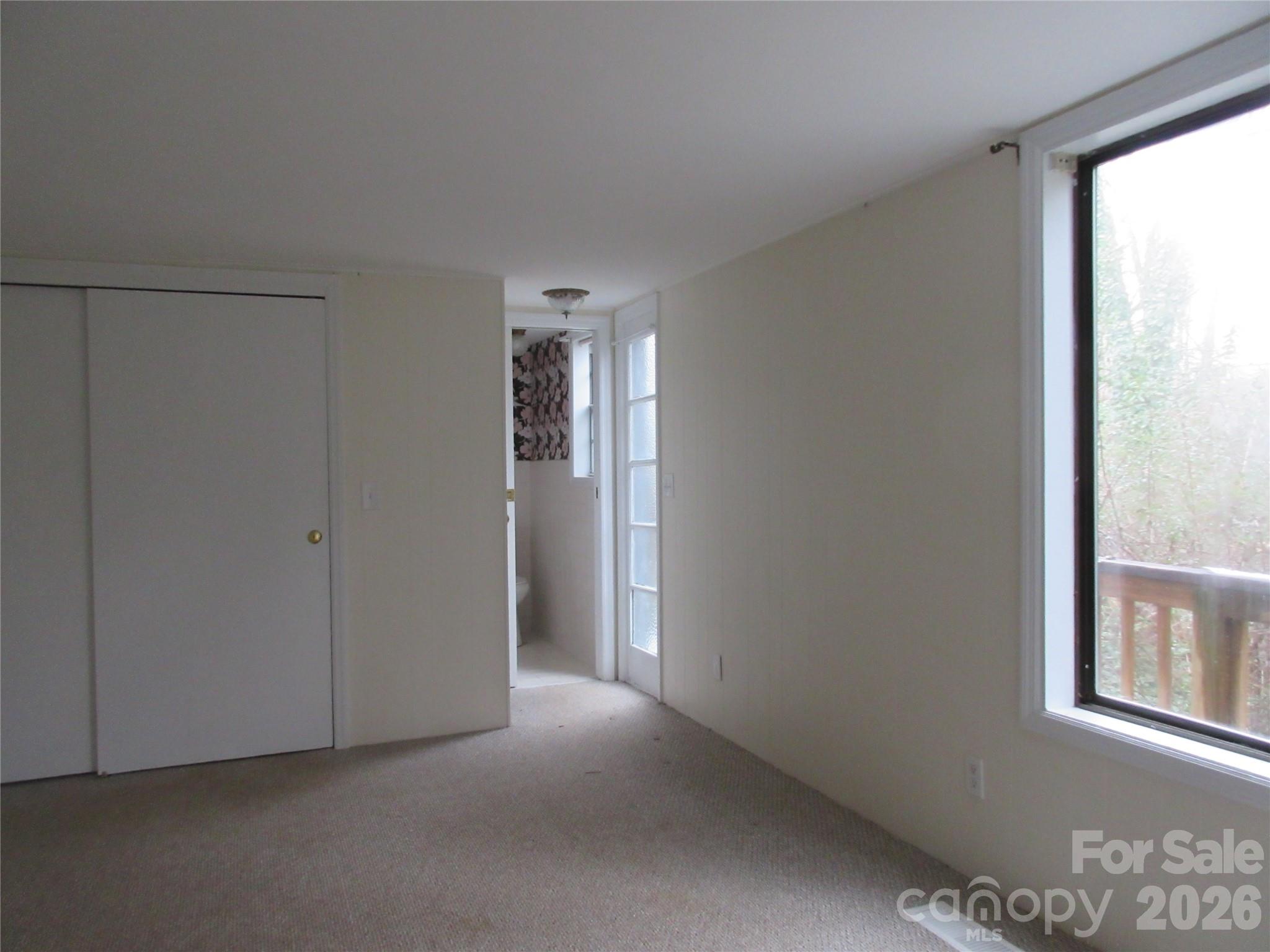31 Ford Ridge Lane Columbus, NC 28722 - Photo 12 of 21 a view of empty room with windows