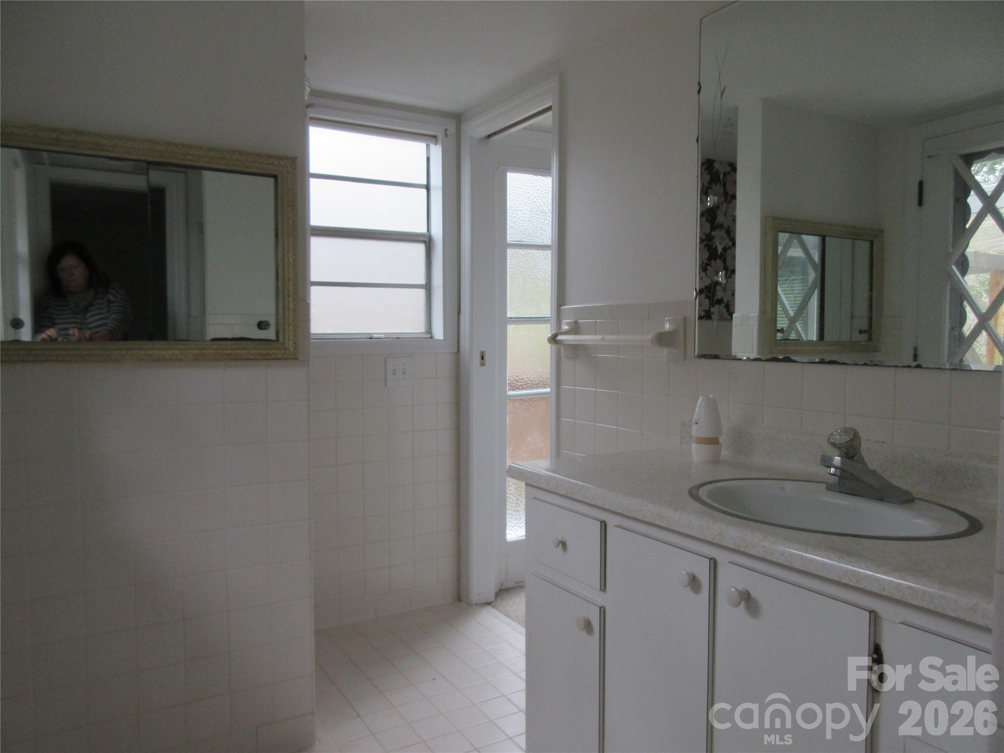31 Ford Ridge Lane Columbus, NC 28722 - Photo 14 of 21 a bathroom with a sink and a mirror