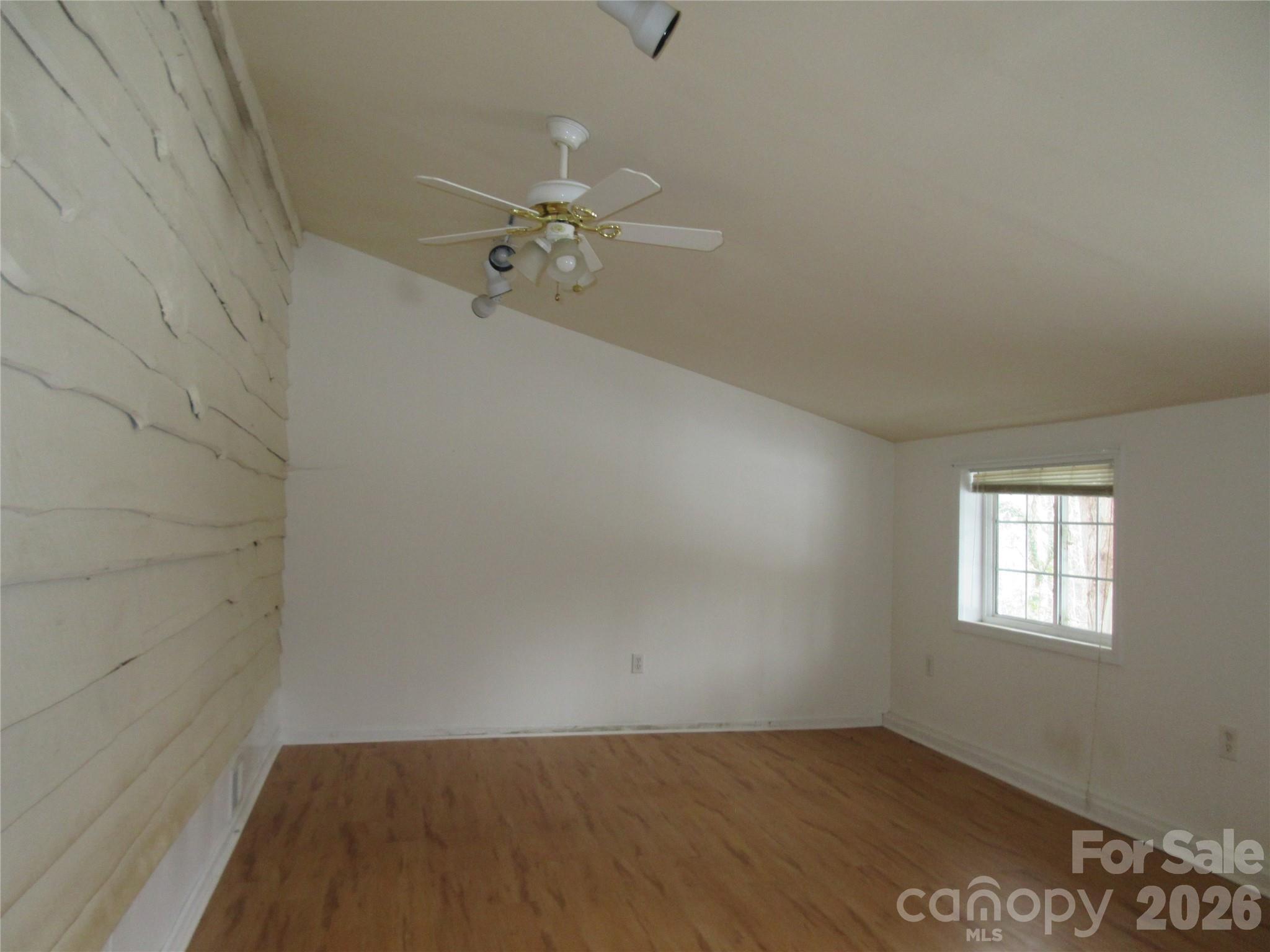 31 Ford Ridge Lane Columbus, NC 28722 - Photo 20 of 21 a view of a room with wooden floor and fan